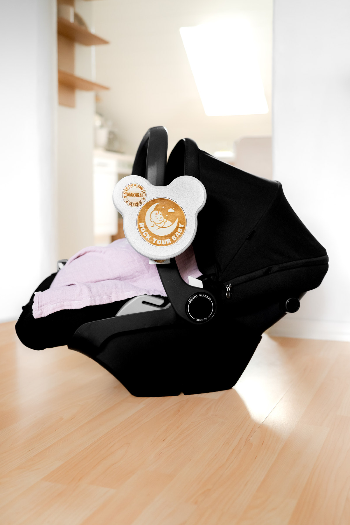 ROCK YOUR BABY attached to an infant car seat.